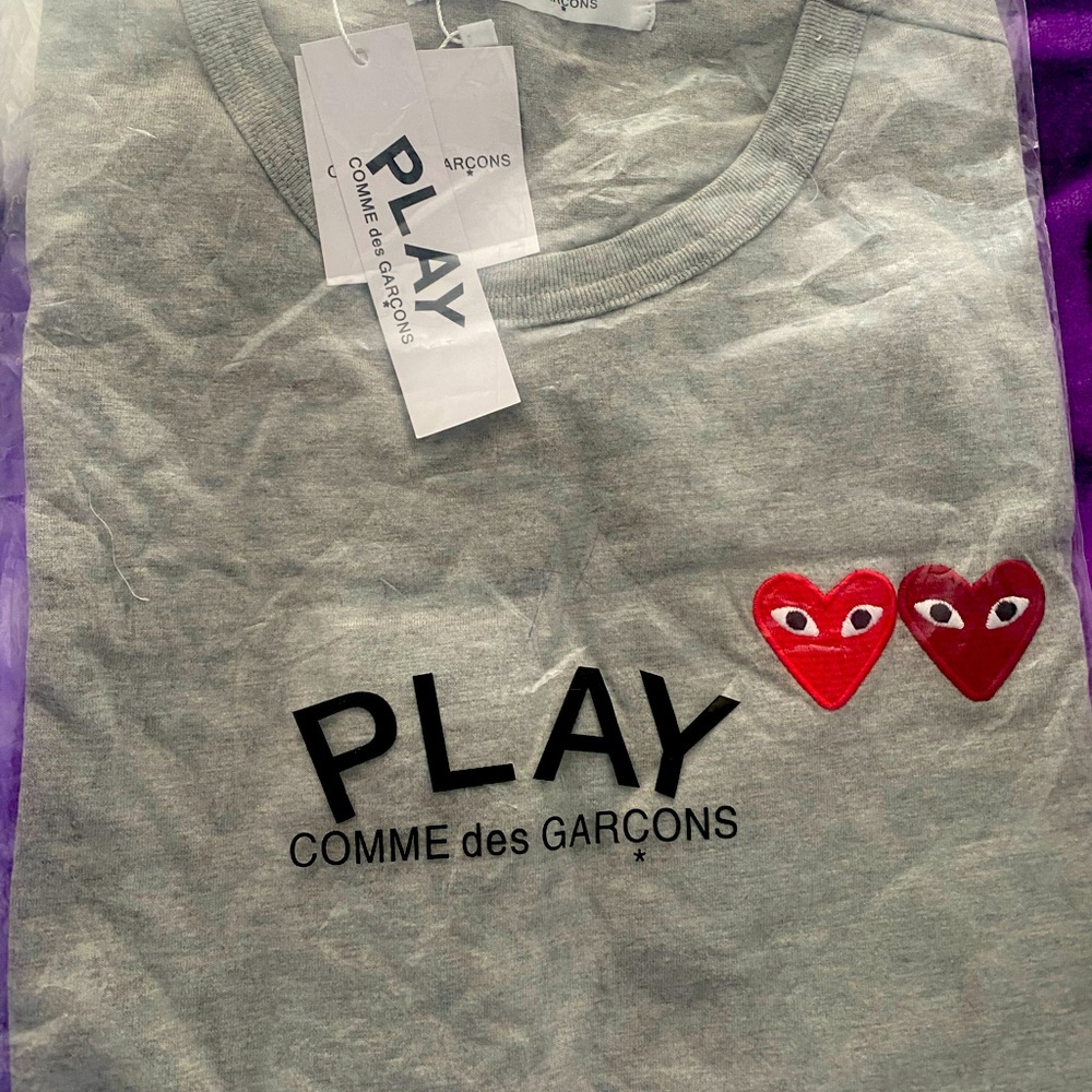 Size XL cdg shirt brand new bagged and tagged.